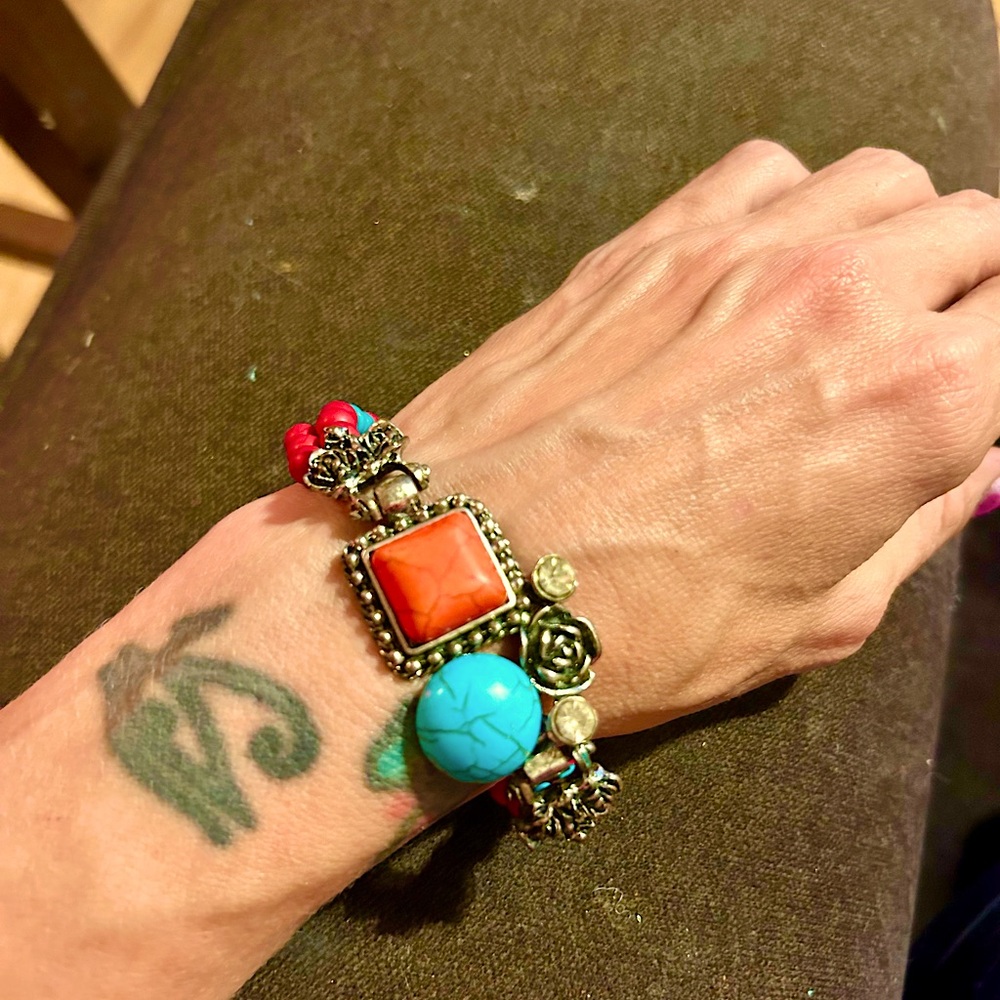 Beaded bracelet with red and turquoise colored stones